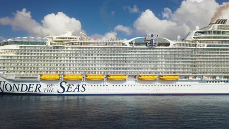 aerial shot of the wonder of the seas royal caribbean cruise ship at dock, panning