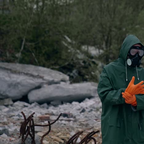 survivor in hazmat suit in destroyed place. human in protective uniform walking in abandoned place after biological attack