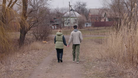 couple walking on a country path