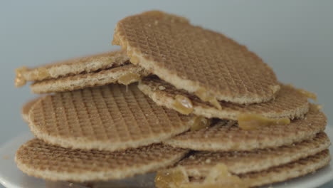 pile on stroopwafels lying on a white plate - fast dolly