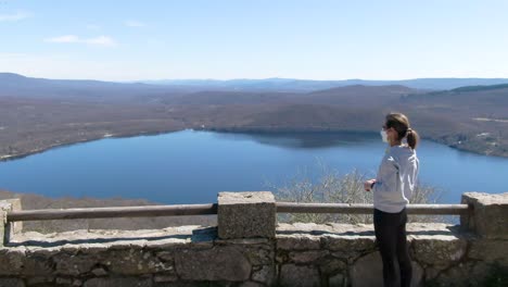 lake sanabria seen from a drone with a model girl