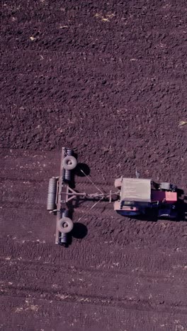 aerial view of the tractor plow a ground