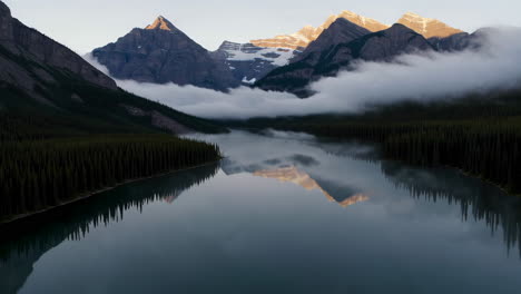misty sunrise over mountain lake