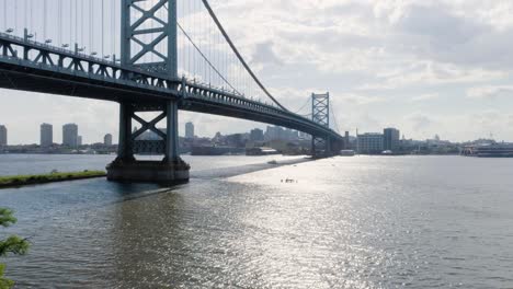 benjamin franklin bridge facing philadelphia skyline from camden - approaching bridge low