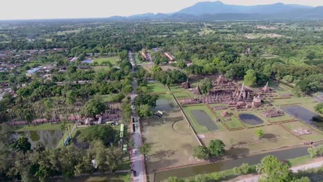 AERIAL-SHOT-OF-SUKHOTHAI-HISTORICAL-PARK-UNESCO-WORLD-HERITAGE-SITE-IN-THAILAND-AT-SUHKOTHAI-PROVINCE,-THAILAND-SHOT-ON-DJI-PT4