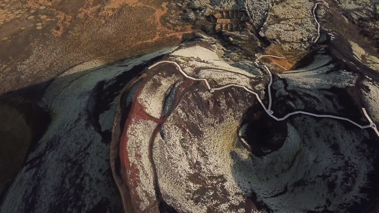 Aerial looking straight down at large volcano crater in Iceland