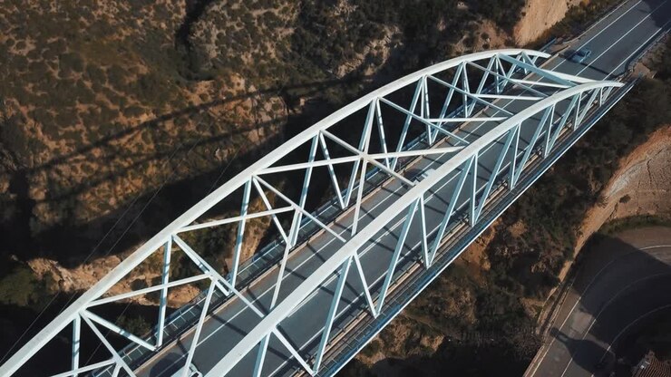 Aerial view of a modern white metal bridge in Spain