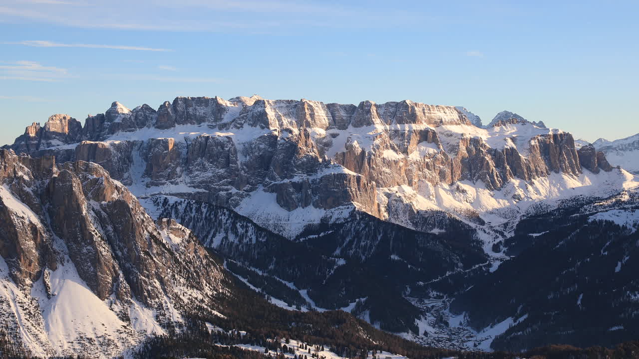 Cold winter snow and blue skies over the Dolomites in the Val Gardena, Italy.