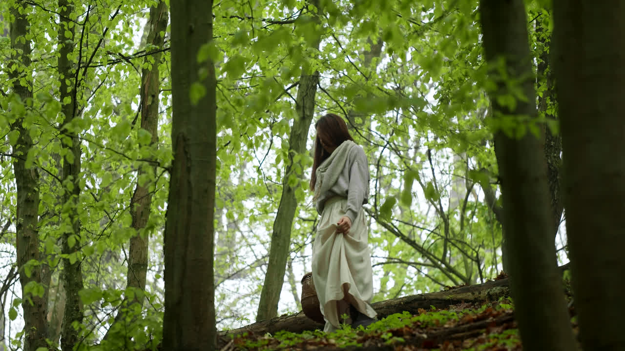 Woman Walking in a Spring Forest