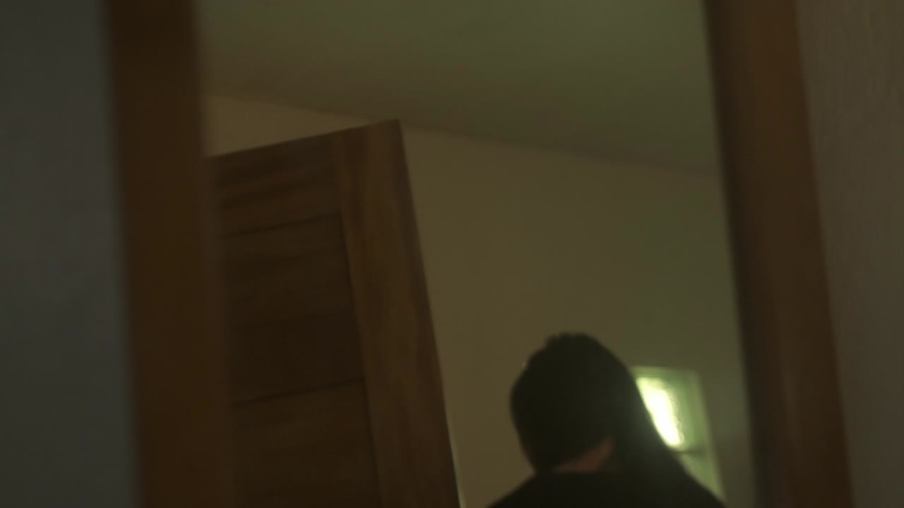 A Glimpse of a Restless Young Woman With Mental Health Issues Gazing Into the Mirror - Close Up