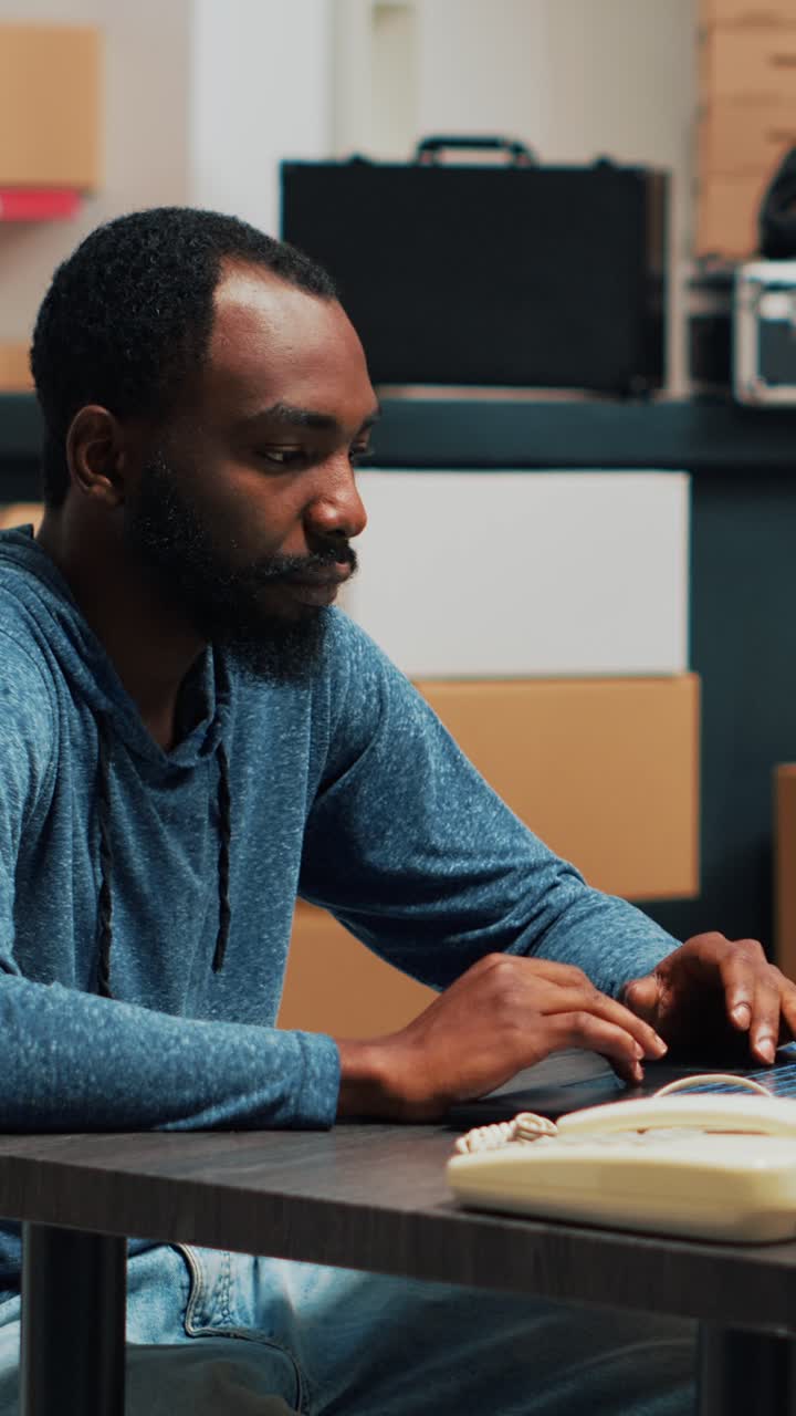 Vertical video: Diverse employees shipping storage products from warehouse