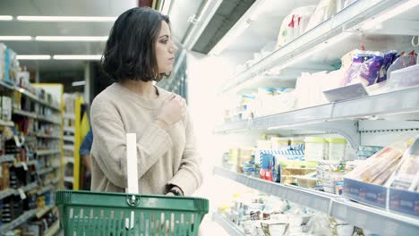 woman choosing products in store