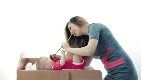 Young-mother-playing-with-her-baby-2