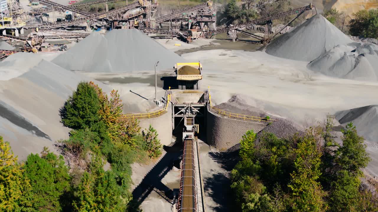 Dump truck preparing to unload gravel into hopper at Jones Mill Quarry Arkansas