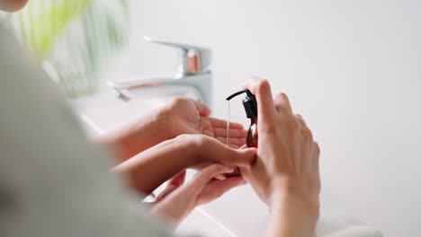 hands, soap and parent with child for cleaning