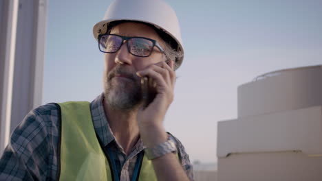 construction site engineer on a phone call