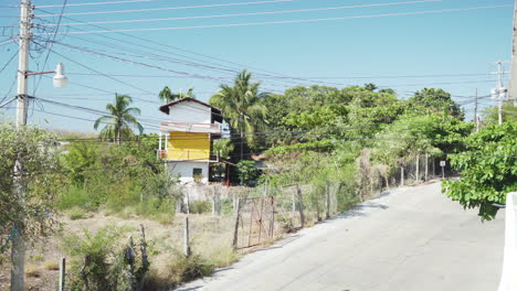 A-remote-dusty-dirt-track-road-in-Puerto-Escondido,-on-the-Oaxaca-coast-in-Mexico