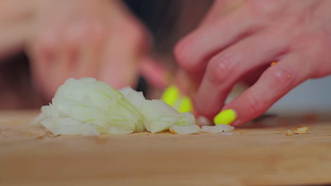 Emotional moment of cooking where onion layers reflect depth of life, fragility