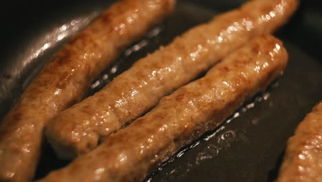 fried sausages in a pan