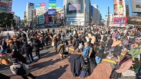 pedestrians crossing a busy urban intersection