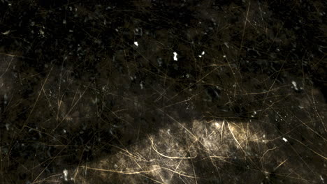 superficie de textura oscura con luz y sombra