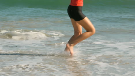 woman running on the beach