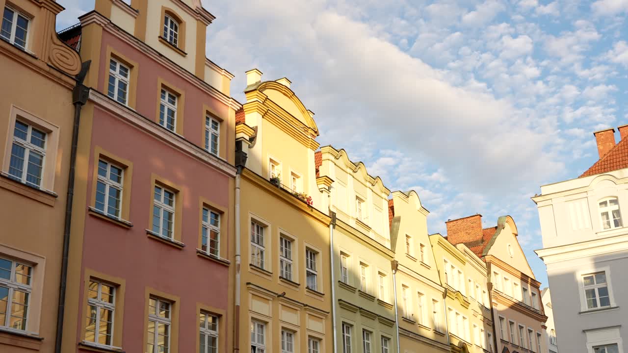 Old charming colourful townhouse facades in sunlight, in Poland