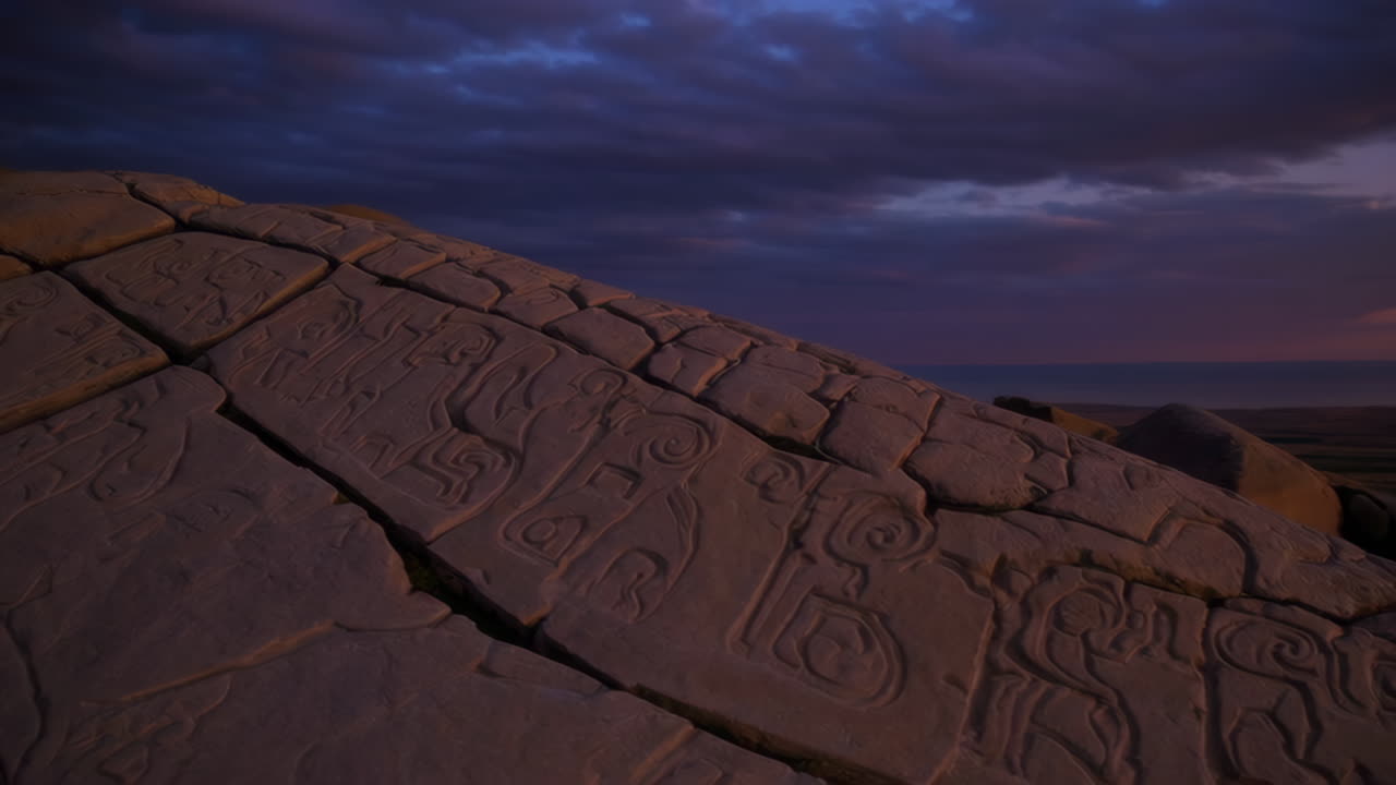 Ancient Rock Carvings at Sunset