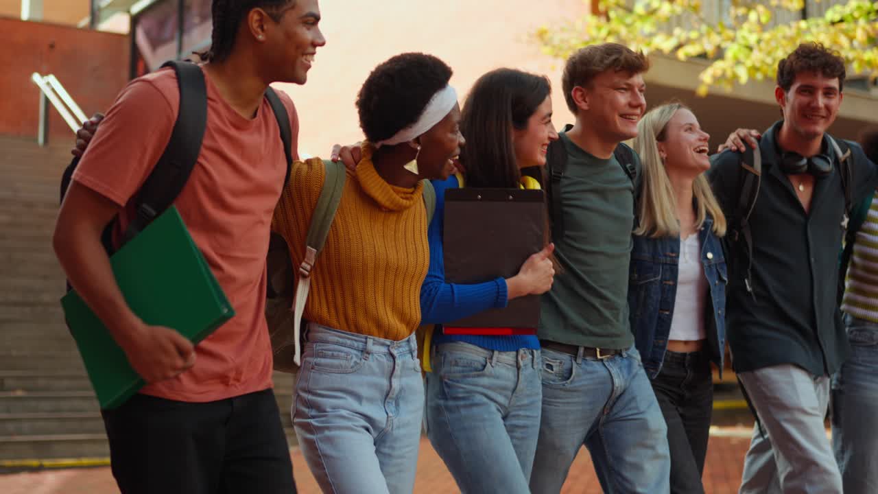 Group of Happy Students Walking Together on Campus