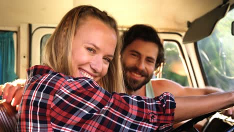 hipster couple sitting in a van