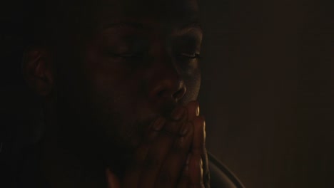 black male devastated from bad news in room