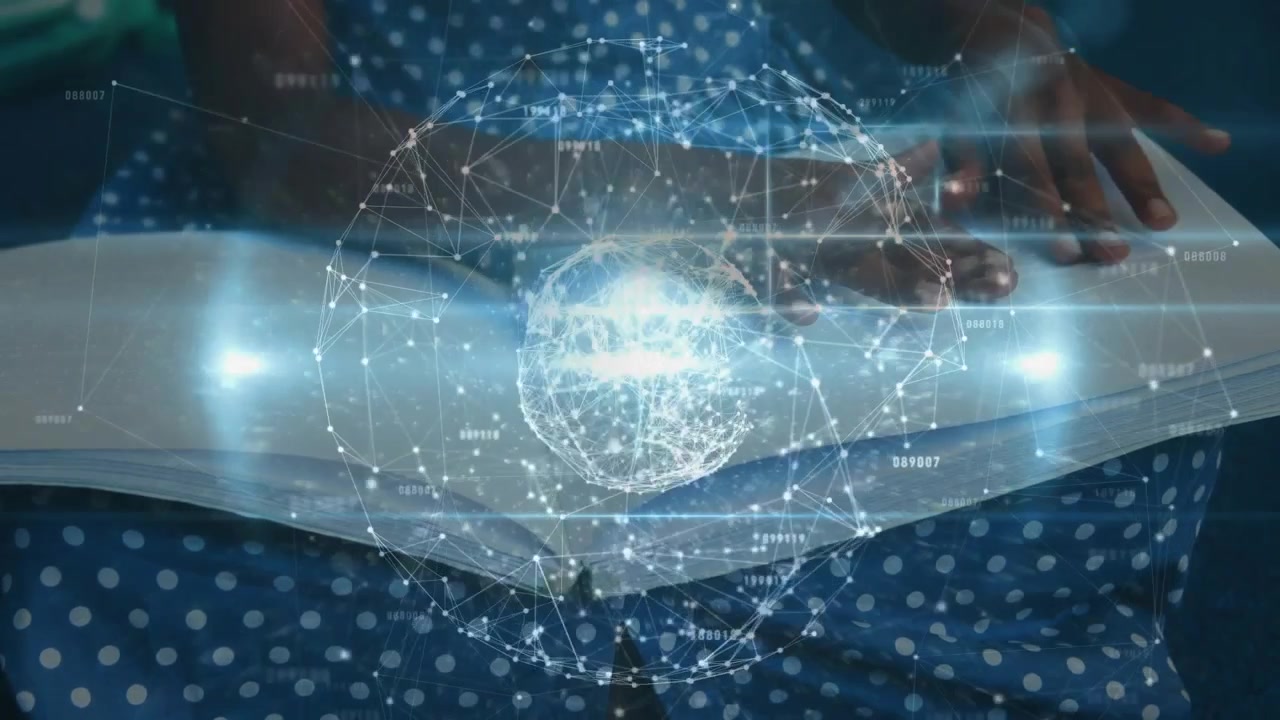 Student placing hands on open book and activating rotating holographic globe for tech education