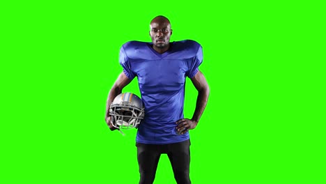 african american football player on green screen background.