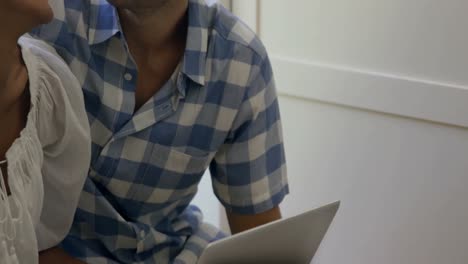 young couple using laptop