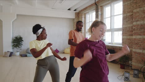 afro couple having private dance lesson with female instructor