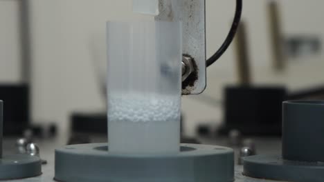 artificial semen collected from machine into flasks in center