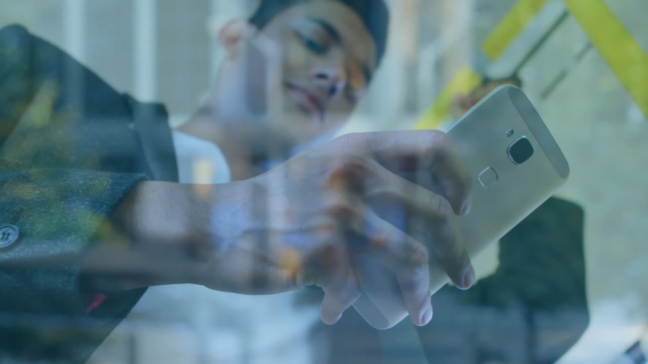 Animation of man using smartphone over cityscape