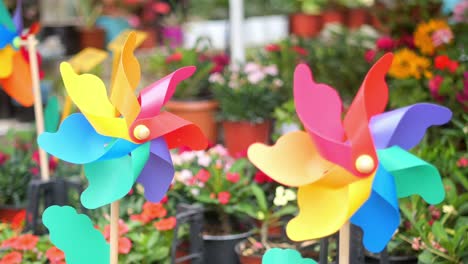 rainbow pinwheels in a garden setting