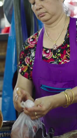 a woman working at a market