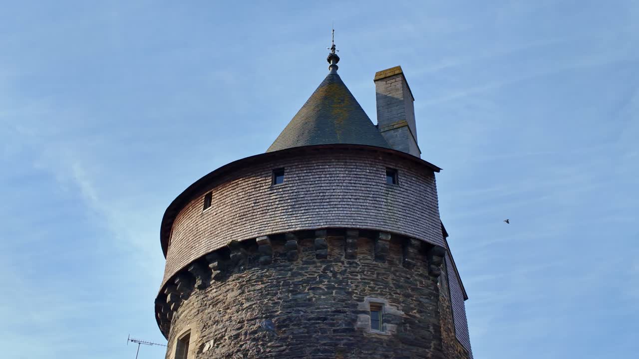 Low angle shot of one of the fortified towers of Château de Vitré, a medieval castle located in Vitré, Brittany, France, a prime example of medieval military architecture, Brittany, France