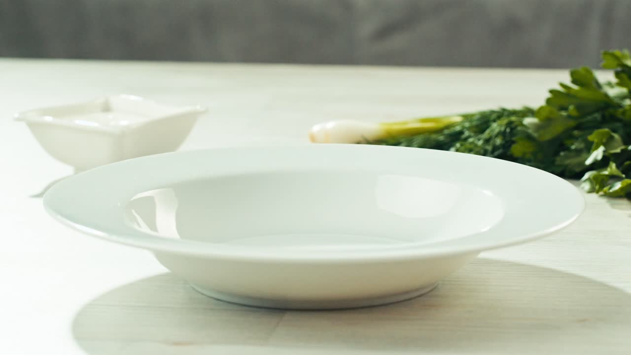 Dumplings in a White Dish with Sauce