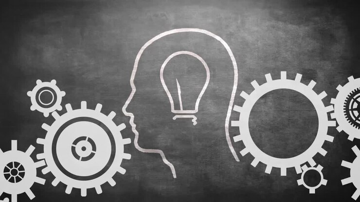 Profile of man with light bulb and gears