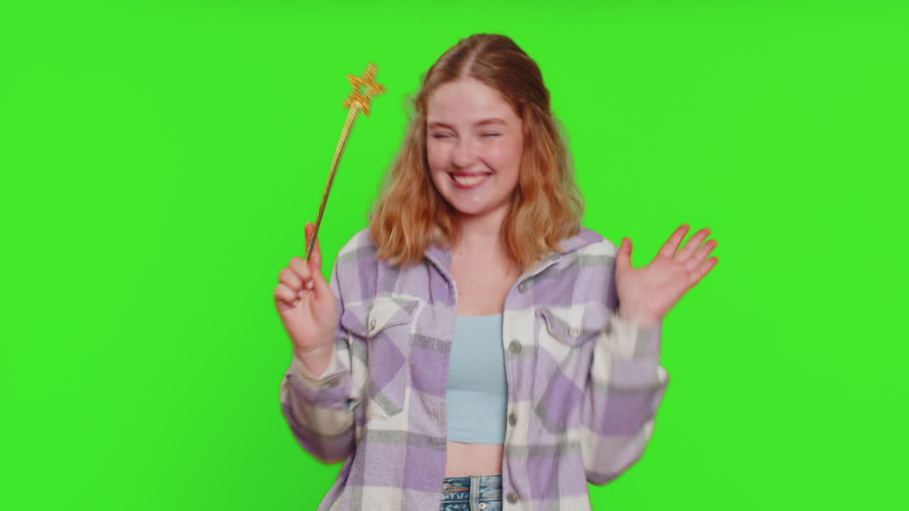 Magician witch young woman gesturing with magic wand making wish come true casting magician spell