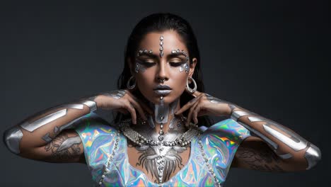 a futuristic portrait: stunning model showcasing intricate body art, reflective elements, and striking accessories in a dark atmospheric setting