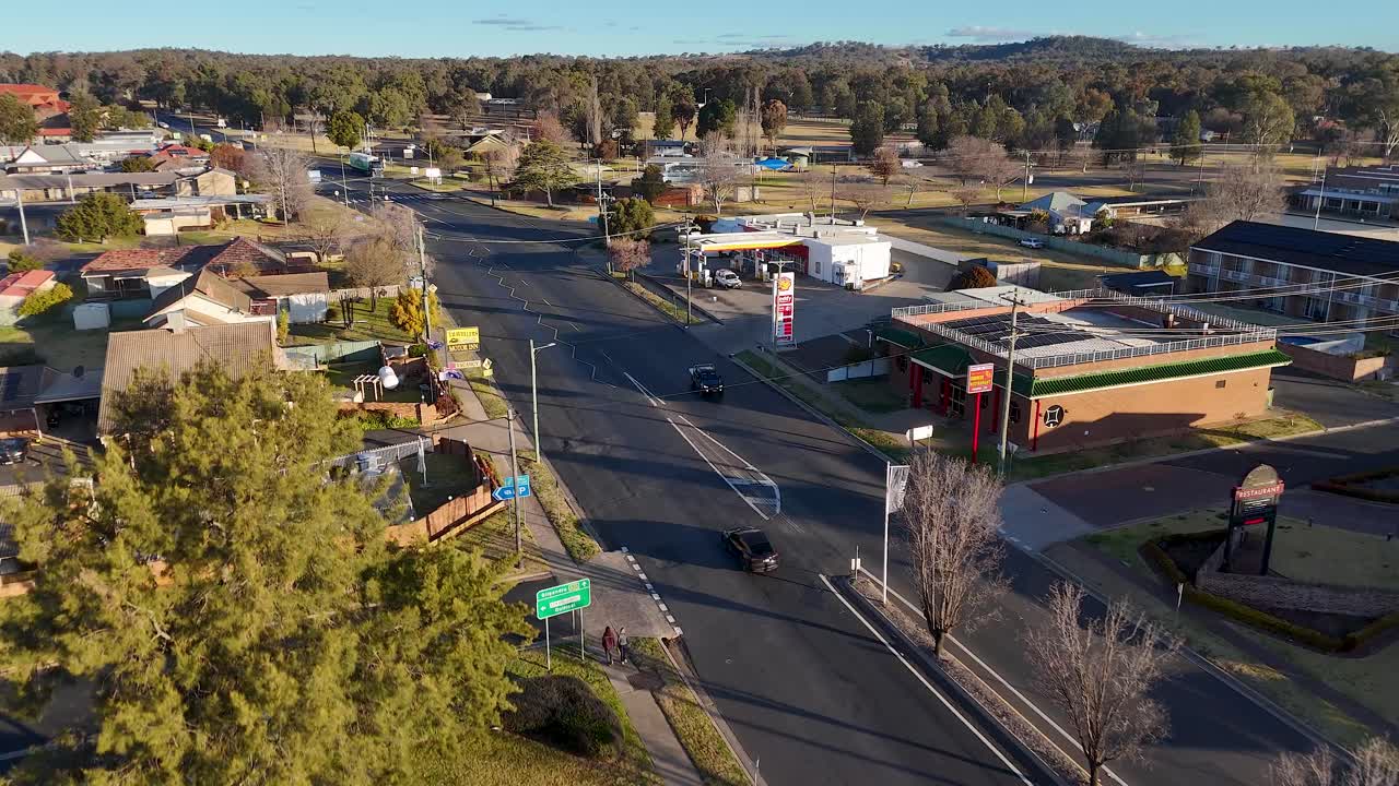 Urban street scene with buildings, cars, and residential area