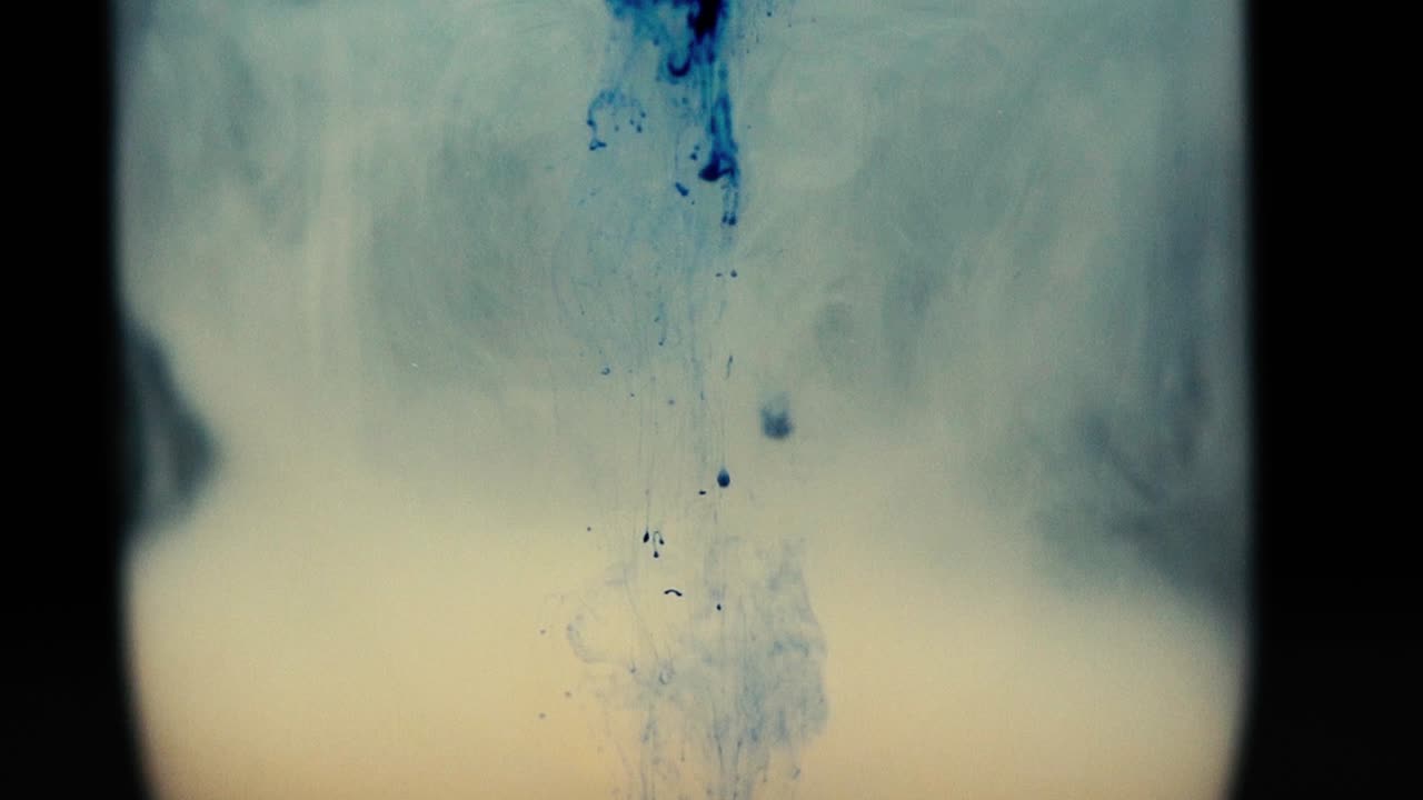 Colored paint floating in water tank. Stable shot with the Sony a7iii