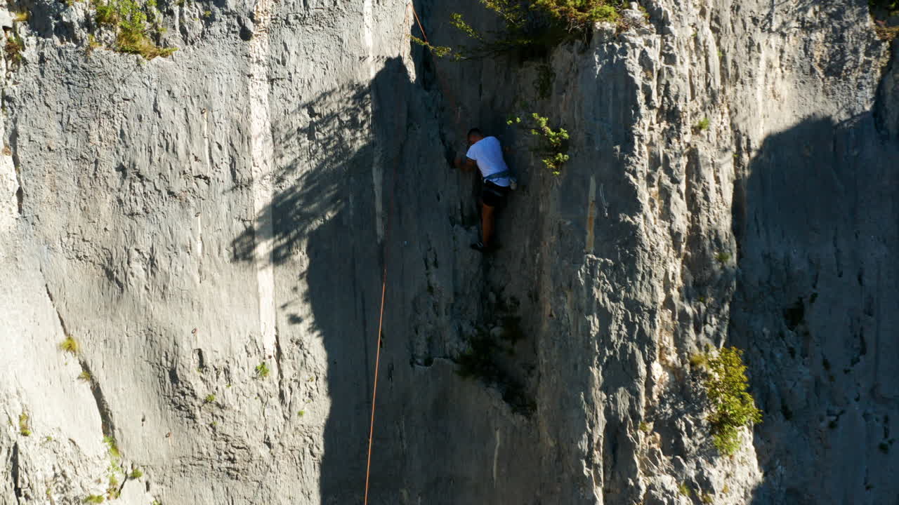 Skilled And Strong Rock Climber Climbing On Limestone Canyon Of Vela Draga In Croatia