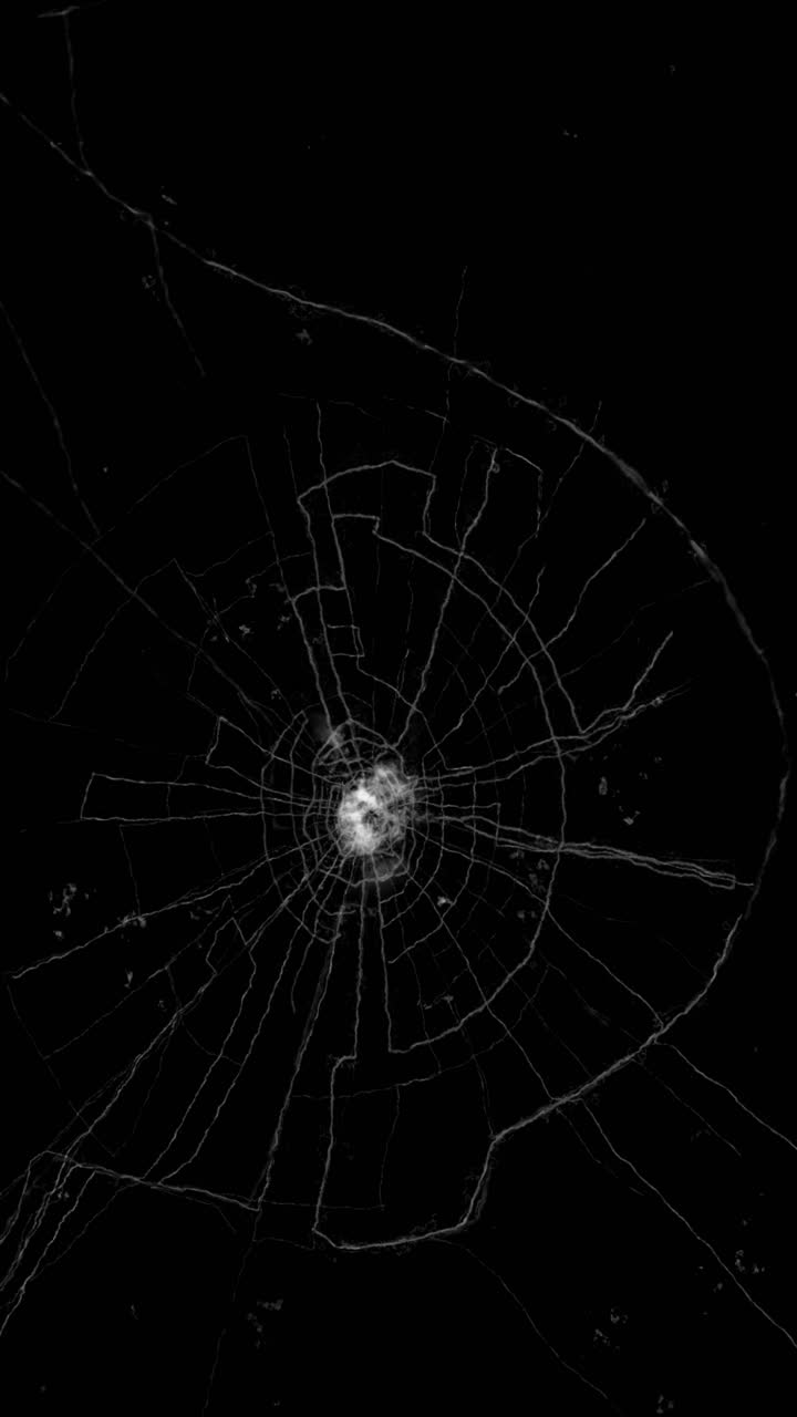 Animation of heavily shattered glass screen from central impact ...