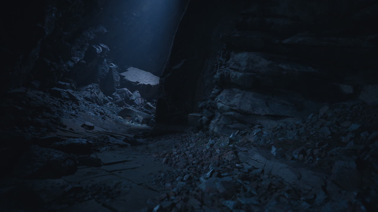 Dark cave exploration revealing rocky terrain and distant light