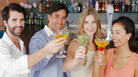 Group-of-friends-toasting-glasses-of-cocktail